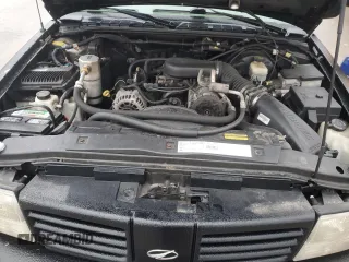 2000 Oldsmobile Bravada z VIN 1GHDT13W5Y2311819, wystawiony jako Copart lot #44839145 z przebiegiem 163 427 mil mil oraz Tytuł czysty. Historia ofert i sprzedaży dostępna na DreamBid. Obrazek 12.