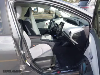 2021 Toyota Prius L Eco with VIN JTDKAMFU4M3134778, listed as a IAAI auction lot 41843429 with 145,757 mi miles. Bid and sale history available at carsss.com. Image 5.