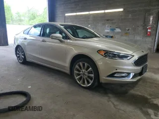 2017 Ford Fusion Titanium z VIN 3FA6P0K96HR132389, wystawiony jako Copart lot #57312665 z przebiegiem Nie podano mil oraz Szkoda całkowita • Salvage title. Historia ofert i sprzedaży dostępna na DreamBid. Obrazek 4.