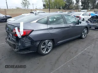 2018 Honda Clarity Plug-In Hybrid with VIN JHMZC5F14JC017006, listed as a IAAI auction lot 42064754 with 36,976 mi miles. Bid and sale history available at carsss.com. Image 4.