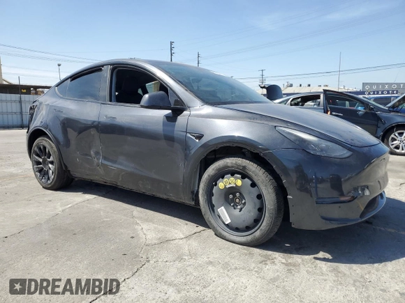 2024 Tesla Model Y Long Range with VIN 7SAYGDEEXRA237667, listed as a Copart auction lot 58260635 with Not provided miles and Salvage title. Bid and sale history available at DreamBid. Image 4.