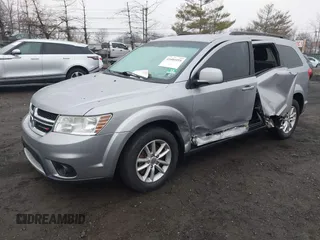 2016 Dodge Journey SXT with VIN 3C4PDDBG2GT242127, listed as a IAAI auction lot 41485555 with 119,728 mi miles. Bid and sale history available at carsss.com. Image 2.