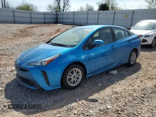 2021 Toyota Prius L Eco z VIN JTDKAMFU2M3131233, wystawiony jako Copart lot #50196575 z przebiegiem 67 903 mil mil oraz Szkoda całkowita • Salvage title. Historia ofert i sprzedaży dostępna na DreamBid. Obrazek 1.