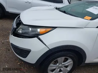 2012 Kia Sportage LX with VIN KNDPB3A2XC7283612, listed as a IAAI auction lot 41957810 with 165,899 mi miles. Bid and sale history available at carsss.com. Image 6.