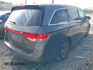 2014 Honda Odyssey Touring with VIN 5FNRL5H99EB111685, listed as a IAAI auction lot 42141227 with 183,484 mi miles and . Bid and sale history available at DreamBid. Image 4.