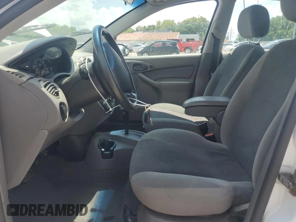 2003 Ford Focus SE with VIN 1FAFP34353W231334, listed as a Copart auction lot 63844205 with 86,601 mi miles and Salvage title. Bid and sale history available at DreamBid. Image 7.
