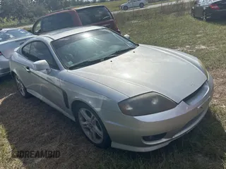 2005 Hyundai Tiburon GT z VIN KMHHN65F85U183258, wystawiony jako Copart lot #80993604 z przebiegiem 281 902 mil mil oraz Tytuł czysty. Historia ofert i sprzedaży dostępna na DreamBid. Obrazek 1.
