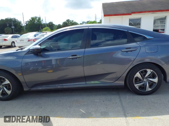 2020 Honda Civic LX with VIN 2HGFC2F65LH575320, listed as a IAAI auction lot 42009564 with Not Provided miles and . Bid and sale history available at DreamBid. Image 14.