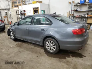 2013 Volkswagen Jetta SE with VIN 3VWDX7AJ2DM309725, listed as a Copart auction lot 86052114 with 70,828 mi miles and Salvage title. Bid and sale history available at DreamBid. Image 2.