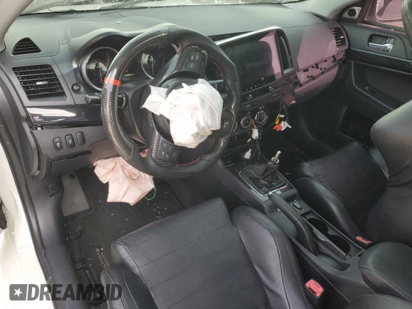 2014 Mitsubishi Lancer Evolution GSR z VIN JA32W8FV2EU019253, wystawiony jako Copart lot #86615084 z przebiegiem 104 894 mil mil oraz Szkody całkowita. Historia ofert i sprzedaży dostępna na DreamBid. Obrazek 8.