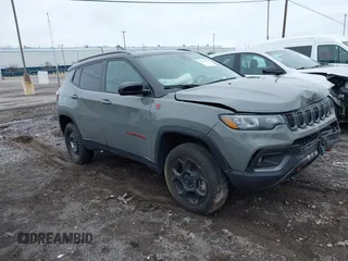 2023 Jeep Compass Trailhawk with VIN 3C4NJDDNXPT562694, listed as a IAAI auction lot 42370873 with 21,988 mi miles and . Bid and sale history available at DreamBid. Image 1.