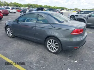 2014 Volkswagen Eos Sport with VIN WVWBW8AH2EV000313, listed as a IAAI auction lot 42333112 with 106,125 mi miles and . Bid and sale history available at DreamBid. Image 3.