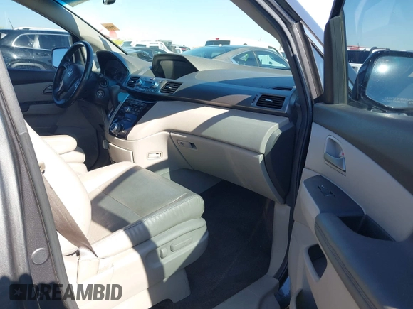 2012 Honda Odyssey EX-L with VIN 5FNRL5H64CB044075, listed as a IAAI auction lot 42094680 with 67,165 mi miles and . Bid and sale history available at carsss.com. Image 5.