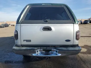 2002 Ford F-150 XLT with VIN 1FTRW08L12KA86849, listed as a Copart auction lot 77861574 with 0 mi miles and Salvage Title. Bid and sale history available at carsss.com. Image 6.