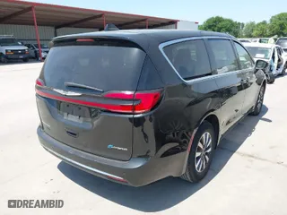 2023 Chrysler Pacifica Hybrid Touring L with VIN 2C4RC1L77PR540958, listed as a IAAI auction lot 42010484 with 61,166 mi miles. Bid and sale history available at carsss.com. Image 4.
