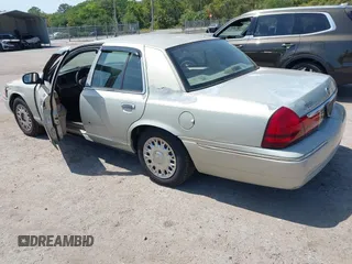 2004 Mercury Grand Marquis GS with VIN 2MEFM74W14X632470, listed as a IAAI auction lot 42120233 with 292,357 mi miles and . Bid and sale history available at DreamBid. Image 3.