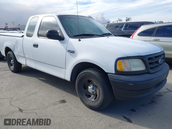 2000 Ford F-150 XL with VIN 1FTZX1727YKA78887, listed as a IAAI auction lot 41291272 with 289,343 mi miles. Bid and sale history available at carsss.com. Image 1.