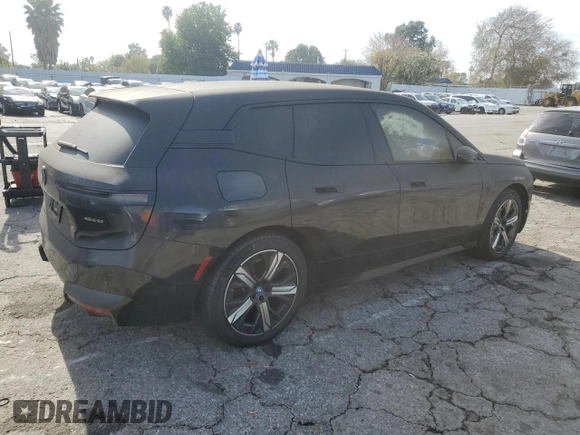 2023 BMW iX xDrive50 with VIN WB523CF0XPCL59062, listed as a Copart auction lot 43813935 with 7,788 mi miles and Salvage Title. Bid and sale history available at carsss.com. Image 3.