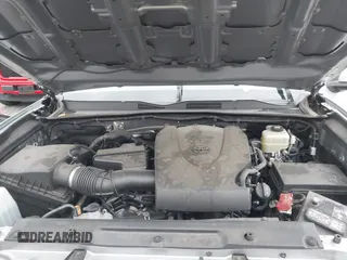 2021 Toyota Tacoma SR z VIN 3TMCZ5AN3MM374132, wystawiony jako IAAI lot #42068562 z przebiegiem 38 654 mil mil oraz . Historia ofert i sprzedaży dostępna na DreamBid. Obrazek 10.