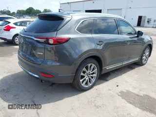 2016 Mazda CX-9 Signature with VIN JM3TCBEY9G0100579, listed as a IAAI auction lot 42282293 with 142,700 mi miles and . Bid and sale history available at DreamBid. Image 4.