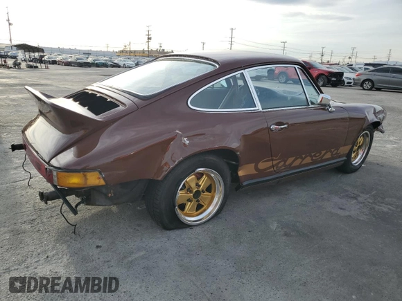 1975 Porsche 911 with VIN 9115201599, listed as a Copart auction lot 79267654 with 69,699 mi miles and Salvage title. Bid and sale history available at DreamBid. Image 3.