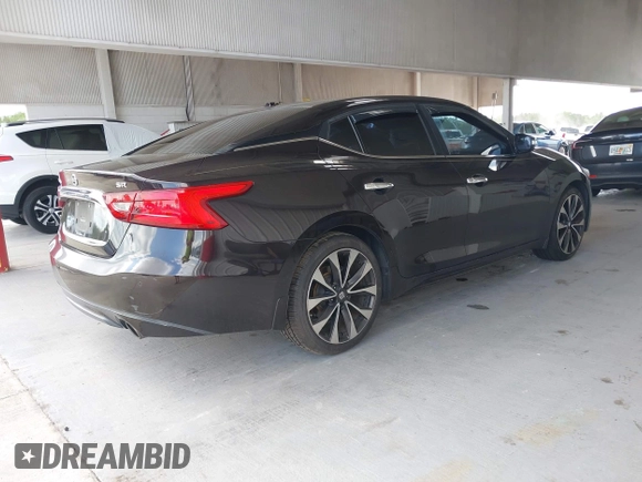 2016 Nissan Maxima SV with VIN 1N4AA6AP5GC413563, listed as a IAAI auction lot 42196144 with 209,711 mi miles and . Bid and sale history available at DreamBid. Image 4.
