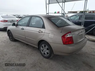 2004 Kia Spectra LX with VIN KNAFE121245064294, listed as a IAAI auction lot 41424241 with 110,136 mi miles. Bid and sale history available at carsss.com. Image 3.