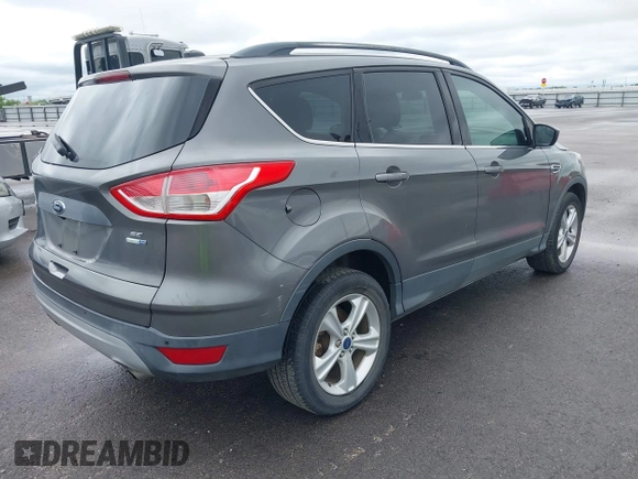 2014 Ford Escape SE with VIN 1FMCU9GX3EUB06947, listed as a IAAI auction lot 42193325 with 138,923 mi miles and . Bid and sale history available at DreamBid. Image 4.