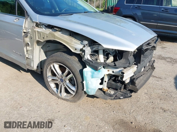 2016 Ford Fusion SE Hybrid z VIN 3FA6P0LU6GR121605, wystawiony jako IAAI lot #42651096 z przebiegiem 194 693 mil mil oraz . Historia ofert i sprzedaży dostępna na DreamBid. Obrazek 6.