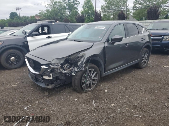 2018 Mazda CX-5 Grand Touring с VIN JM3KFBDM8J0424633, выставлен на аукционе Copart как лот 59888035 с пробегом 77 721 миль миль и Списание • Salvage title. История ставок и продаж доступна на DreamBid. Изображение 1.