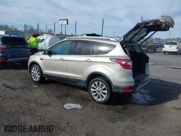 2017 Ford Escape Titanium with VIN 1FMCU0JD3HUB19602, listed as a IAAI auction lot 41816296 with 70,311 mi miles. Bid and sale history available at carsss.com. Image 3.