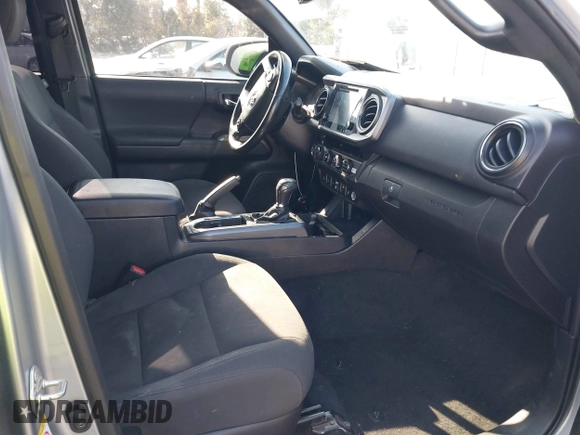 2018 Toyota Tacoma SR with VIN 3TMCZ5AN6JM185891, listed as a IAAI auction lot 41450665 with 53,749 mi miles and . Bid and sale history available at DreamBid. Image 5.