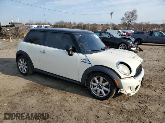 2011 MINI Hardtop S with VIN WMWSV3C59BTY23205, listed as a Copart auction lot 48672675 with 120,457 mi miles and Salvage Title. Bid and sale history available at DreamBid. Image 4.