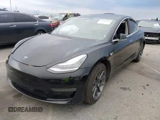 2019 Tesla Model 3 Mid Range with VIN 5YJ3E1EA6KF361808, listed as a IAAI auction lot 41767241 with 96,200 mi miles and . Bid and sale history available at carsss.com. Image 19.