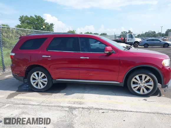 2013 Dodge Durango Crew z VIN 1C4RDJDG6DC672934, wystawiony jako IAAI lot #42542073 z przebiegiem 181 812 mil mil oraz . Historia ofert i sprzedaży dostępna na DreamBid. Obrazek 13.