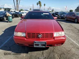 1999 Cadillac Eldorado Touring z VIN 1G6ET1293XU611368, wystawiony jako Copart lot #82683114 z przebiegiem 126 178 mil mil oraz Szkody całkowita. Historia ofert i sprzedaży dostępna na DreamBid. Obrazek 5.
