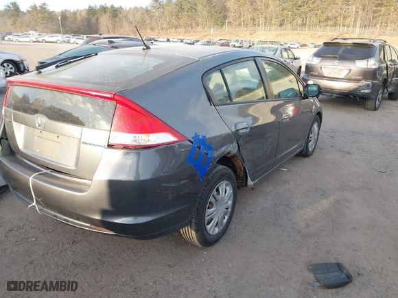 2010 Honda Insight LX with VIN JHMZE2H52AS014667, listed as a IAAI auction lot 41258620 with 138,419 mi miles. Bid and sale history available at carsss.com. Image 4.