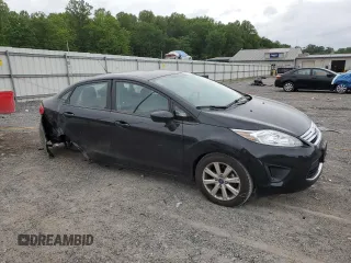 2012 Ford Fiesta SE z VIN 3FADP4BJ8CM152416, wystawiony jako Copart lot #57753335 z przebiegiem 25 293 mil mil oraz Szkody całkowita. Historia ofert i sprzedaży dostępna na DreamBid. Obrazek 4.