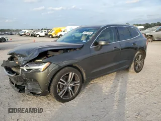 2018 Volvo XC60 Momentum with VIN LYV102RK0JB106389, listed as a Copart auction lot 82677454 with 114,832 mi miles and Salvage Title. Bid and sale history available at carsss.com. Image 1.