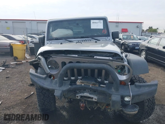 2013 Jeep Wrangler Rubicon 10th Anniversary with VIN 1C4BJWCG8DL639121, listed as a IAAI auction lot 40561773 with 56,023 mi miles and . Bid and sale history available at DreamBid. Image 12.