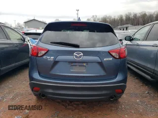 2016 Mazda CX-5 Grand Touring with VIN JM3KE4DY7G0761594, listed as a Copart auction lot 51514595 with 58,250 mi miles and Salvage Title. Bid and sale history available at DreamBid. Image 6.