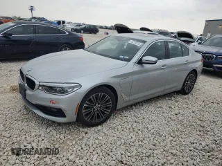 2018 BMW 5 Series 530e xDrive with VIN WBAJB1C58JB084292, listed as a Copart auction lot 51213575 with 105,277 mi miles and Clean title. Bid and sale history available at DreamBid. Image 1.