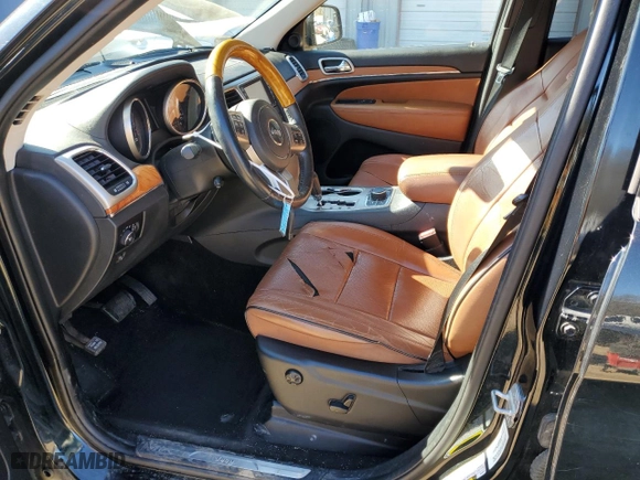 2012 Jeep Grand Cherokee Overland with VIN 1C4RJFCG0CC232021, listed as a Copart auction lot 89358695 with 129,196 mi miles and Salvage Title. Bid and sale history available at carsss.com. Image 7.