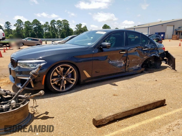 2018 BMW 5 Series M550i xDrive with VIN WBAJB9C54JB286450, listed as a Copart auction lot 61232125 with 88,479 mi miles and Salvage title. Bid and sale history available at DreamBid. Image 1.