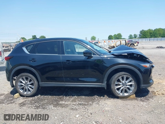 2020 Mazda CX-5 Grand Touring with VIN JM3KFADM9L1837183, listed as a IAAI auction lot 42340628 with 81,975 mi miles and . Bid and sale history available at DreamBid. Image 13.