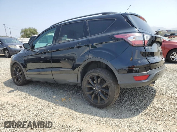2017 Ford Escape SE z VIN 1FMCU0G92HUD20328, wystawiony jako Copart lot #55181485 z przebiegiem Nie podano mil oraz Szkoda całkowita • Salvage title. Historia ofert i sprzedaży dostępna na DreamBid. Obrazek 2.