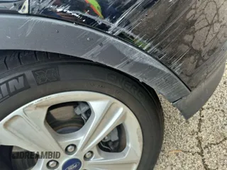 2016 Ford Escape SE z VIN 1FMCU9GX9GUC01824, wystawiony jako IAAI lot #42396853 z przebiegiem 57 608 mil mil oraz . Historia ofert i sprzedaży dostępna na DreamBid. Obrazek 18.