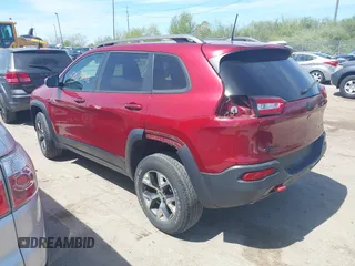 2016 Jeep Cherokee Trailhawk with VIN 1C4PJMBS9GW237059, listed as a IAAI auction lot 42079788 with 114,513 mi miles. Bid and sale history available at carsss.com. Image 3.