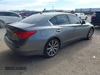 2014 Infiniti Q50 Premium with VIN JN1BV7AR1EM701665, listed as a IAAI auction lot 41276373 with 113,820 mi miles. Bid and sale history available at carsss.com. Image 4.