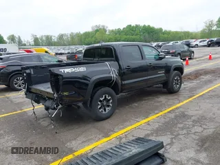 2021 Toyota Tacoma SR with VIN 3TMCZ5AN0MM417261, listed as a IAAI auction lot 42240693 with 38,625 mi miles and . Bid and sale history available at DreamBid. Image 4.